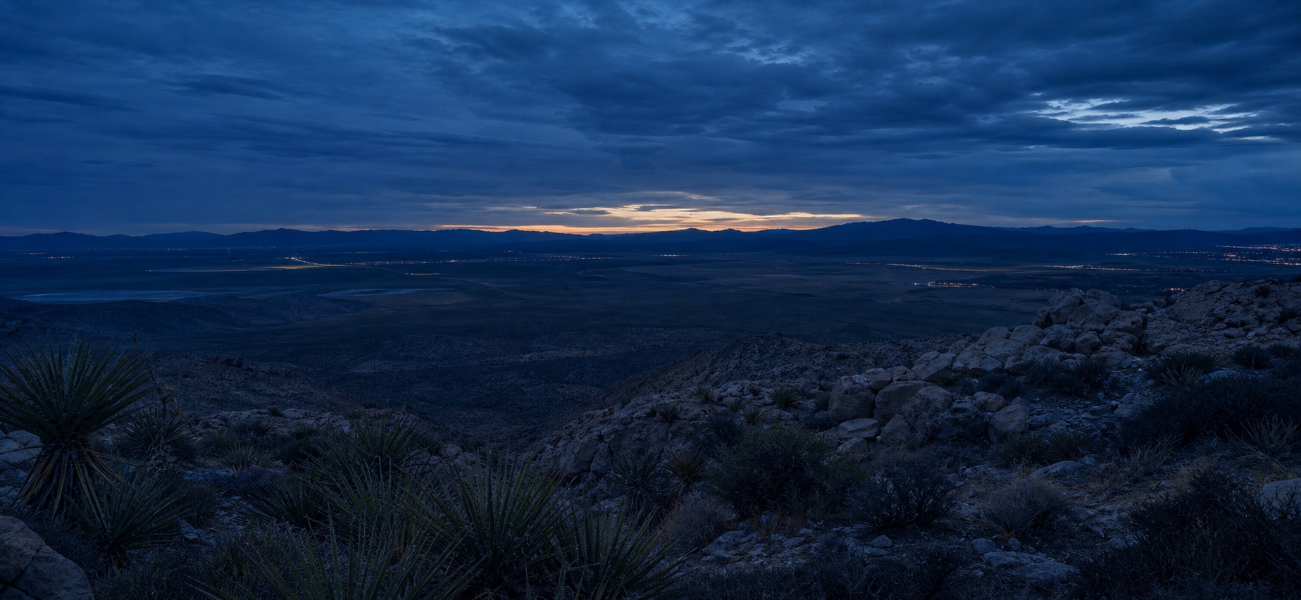 Panoramic Nevada valley and mountains at deep blue hour